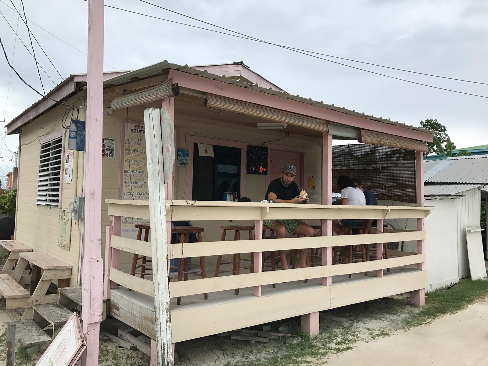 Guy eating at Fry Jacks in Belize, Mexico. Chichén Itzá and the Yucatán coast