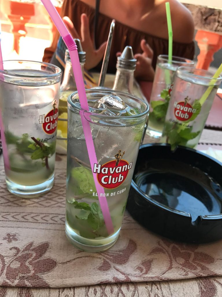Glasses of drinks with straws in Havana, Cuba. Cigars, cars & cocktails in Cuba