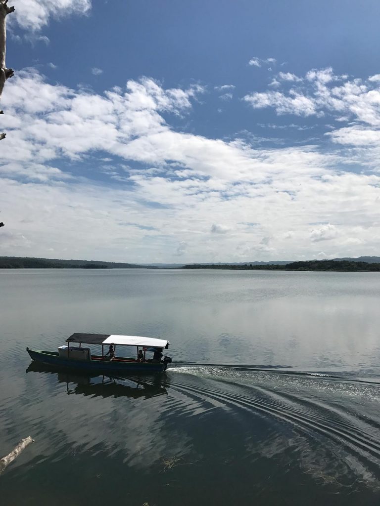 Boat in the lake in Flores, Guatemala. A dislocated shoulder & Tikal Ruins
