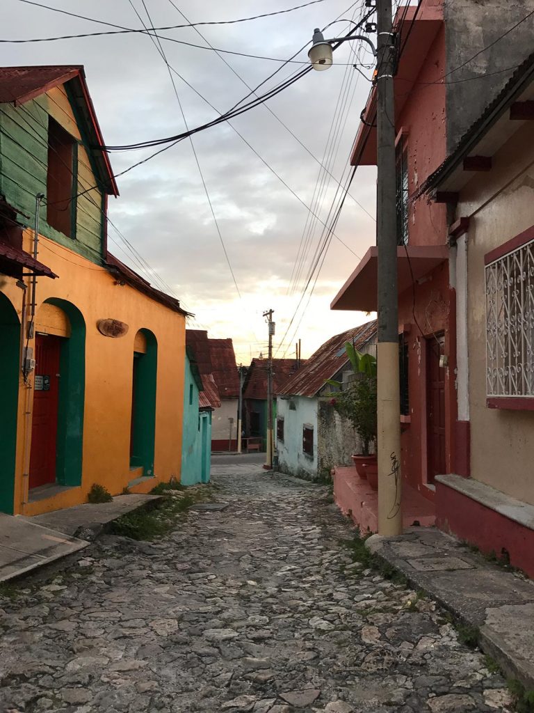 Colorful houses and cobblestone walks in Flores, Guatemala. A dislocated shoulder & Tikal Ruins