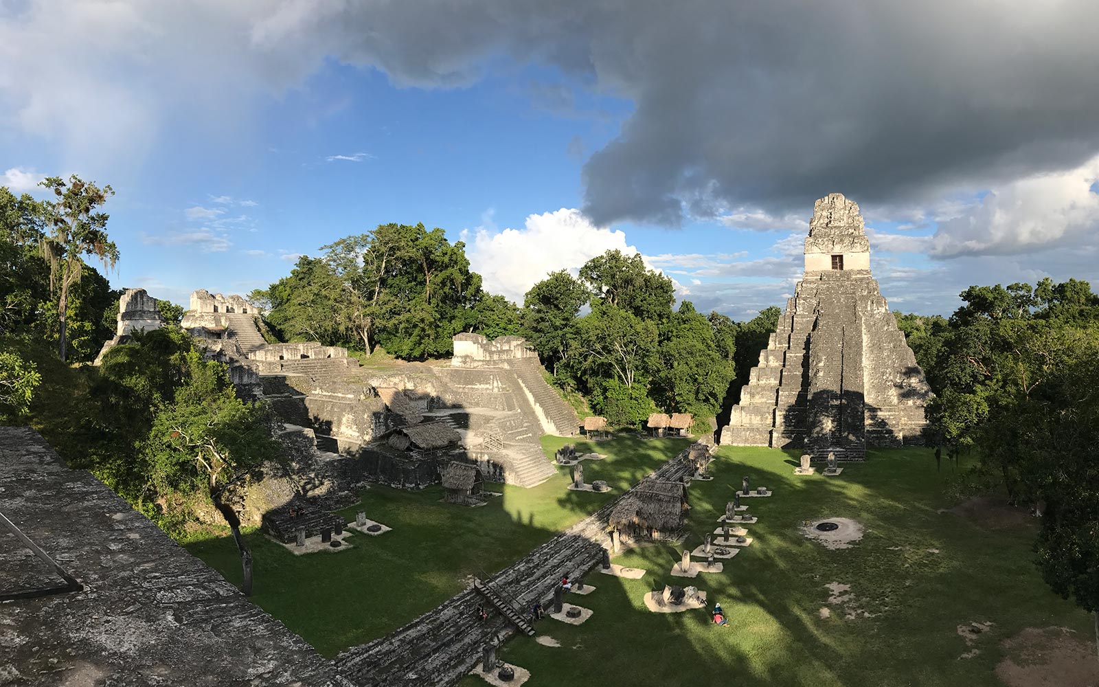 Mayan ruins among trees in Tikal, Guatemala. A dislocated shoulder & Tikal Ruins