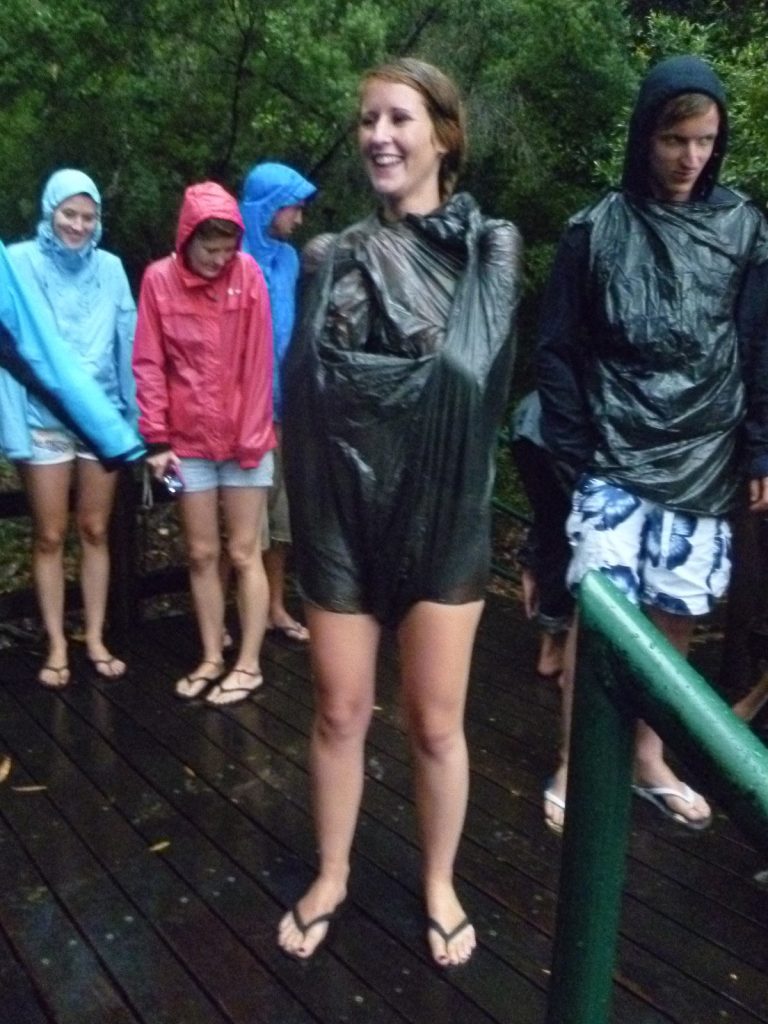 David Simpson with a guy and three girls in raincoats in Fraser Island. Dingos on Fraser Island
