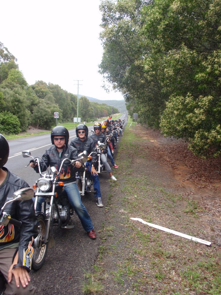 Guys riding motor bikes in Scooter Roo tour in Fraser Island. Dingos on Fraser Island