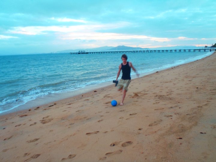 David Simpson on the beach with a ball in Fraser Island. Dingos on Fraser Island