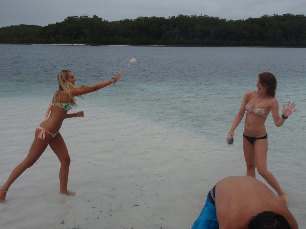 Two girls playing ball in Fraser Island. Dingos on Fraser Island