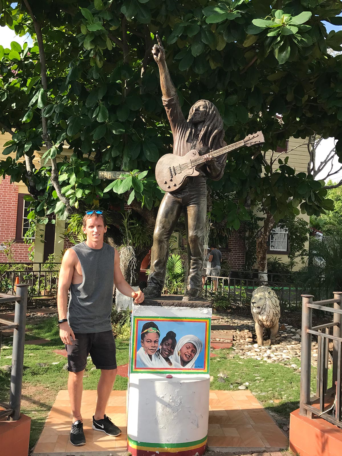 David Simpson with statue of Bob Marley at his house in Negril, Jamaica. Getting chased in Jamaica