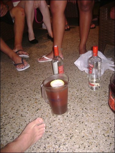Feet and drinks in Miami. Miami's sinking ship