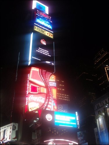 A lighted building at night in New York. New York, the final stop