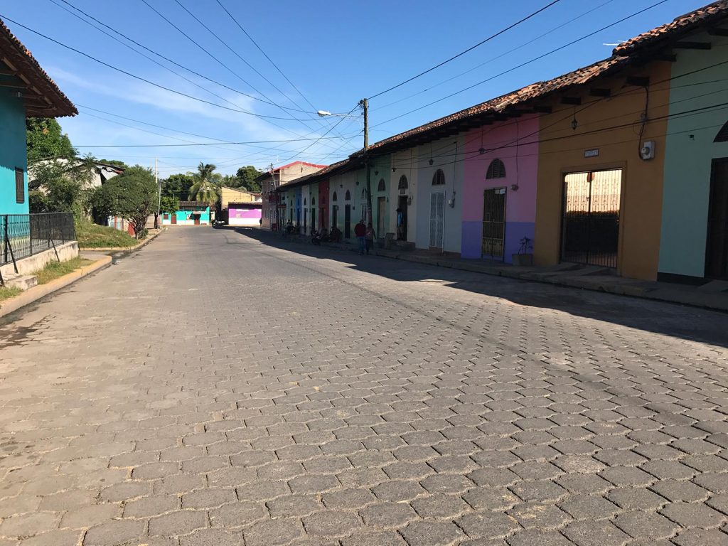 Colorful houses and brick road in Granada, Nicaragua. Volcano boarding in Leon, Nicaragua & full guide