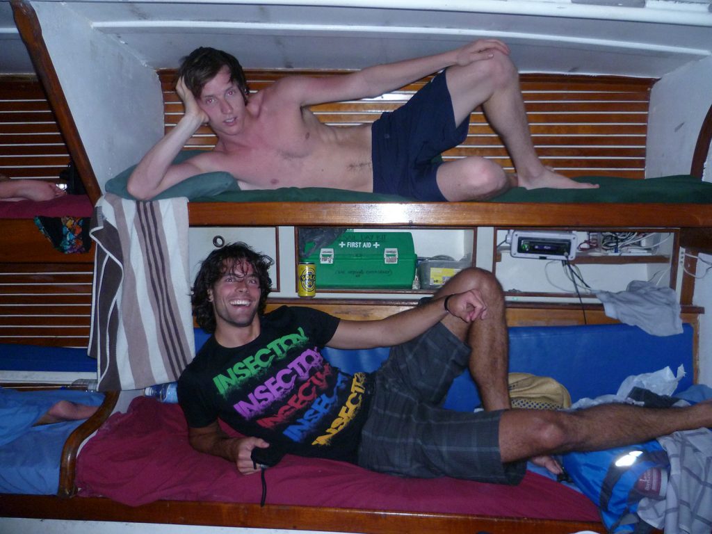 David Simpson and a guy showing off their beds during the Whitsundays cruise. Sleeping under the stars at the Whitsundays