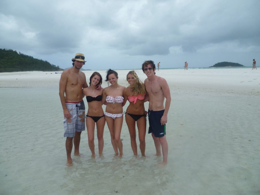 David Simpson and a guy and three girls in Whitehaven beach during the Whitsundays cruise. Sleeping under the stars at the Whitsundays