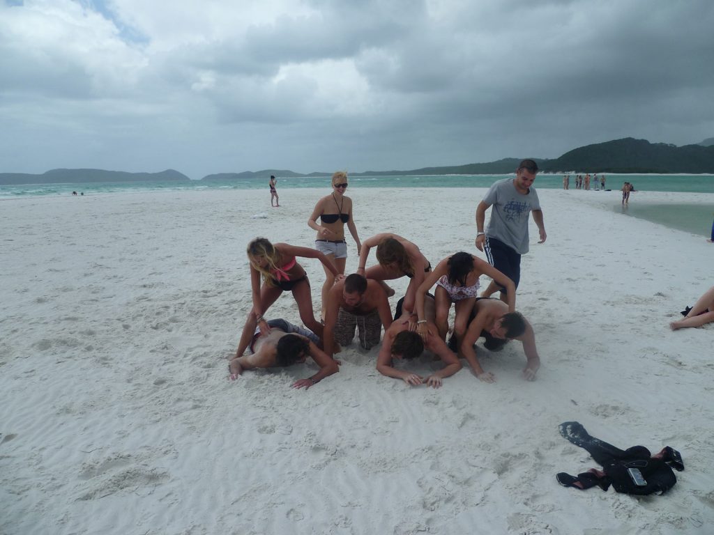 David Simpson and four guys and four girls doing the pyramid in Whitehaven beach during the Whitsundays cruise. Sleeping under the stars at the Whitsundays