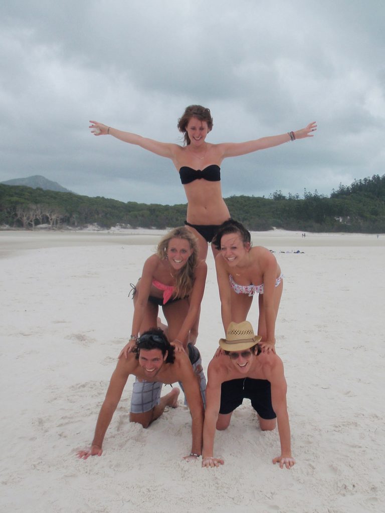 David Simpson and a guy and three girls doing the pyramid in Whitehaven beach during the Whitsundays cruise. Sleeping under the stars at the Whitsundays