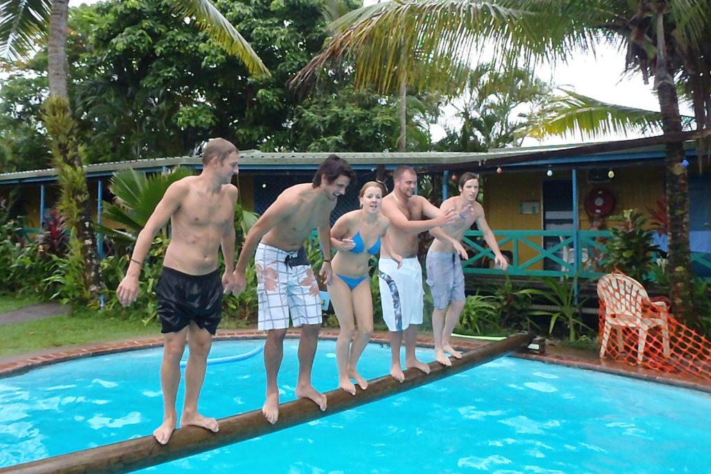 David Simpson, a girl and three guys standing on a log about to jump in the pool in East Coast Australia. Settling into the east coast nicely