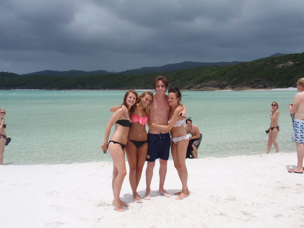 David Simpson and three girls in Whitehaven beach during the Whitsundays cruise. Sleeping under the stars at the Whitsundays