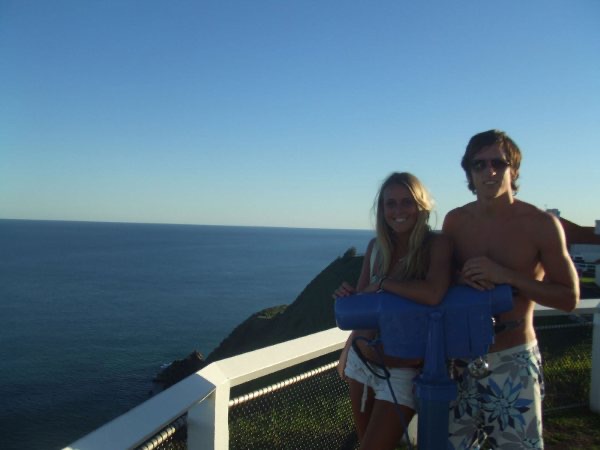 David Simpson and a girl during sunset at the lighthouse at Byron Bay Beach. The Zoo, Brissie & Byron Bay