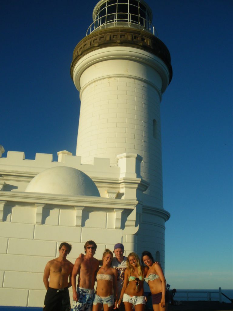 David Simpson with two guys and three girls during sunset at the lighthouse at Byron Bay Beach. The Zoo, Brissie & Byron Bay