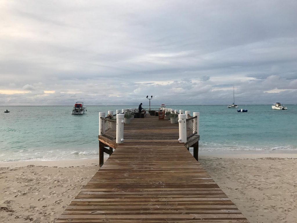 Beach and wooden platform in Turks & Caicos. The scariest flight of my life