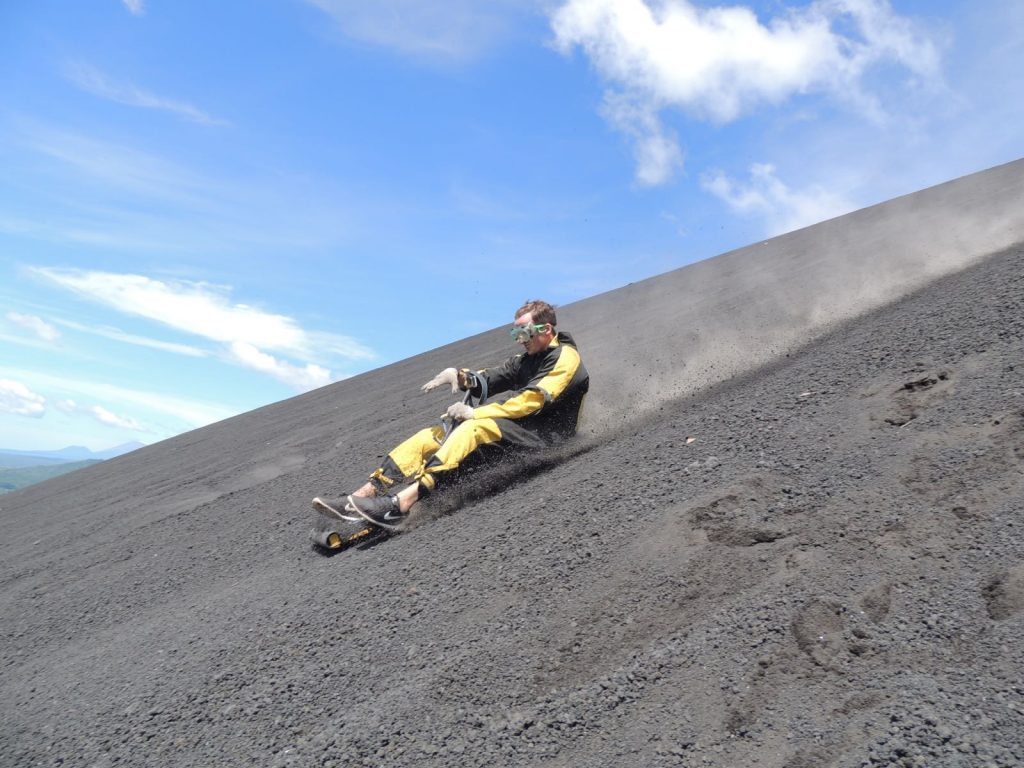 David Simpson boarding down the not active volcano in Leon, Nicaragua. Volcano boarding in Leon, Nicaragua & full guide