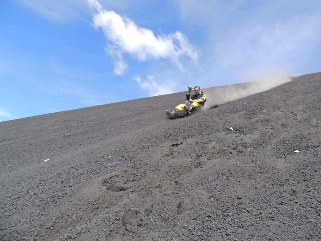 David Simpson boarding down the not active volcano in Leon, Nicaragua. Volcano boarding in Leon, Nicaragua & full guide