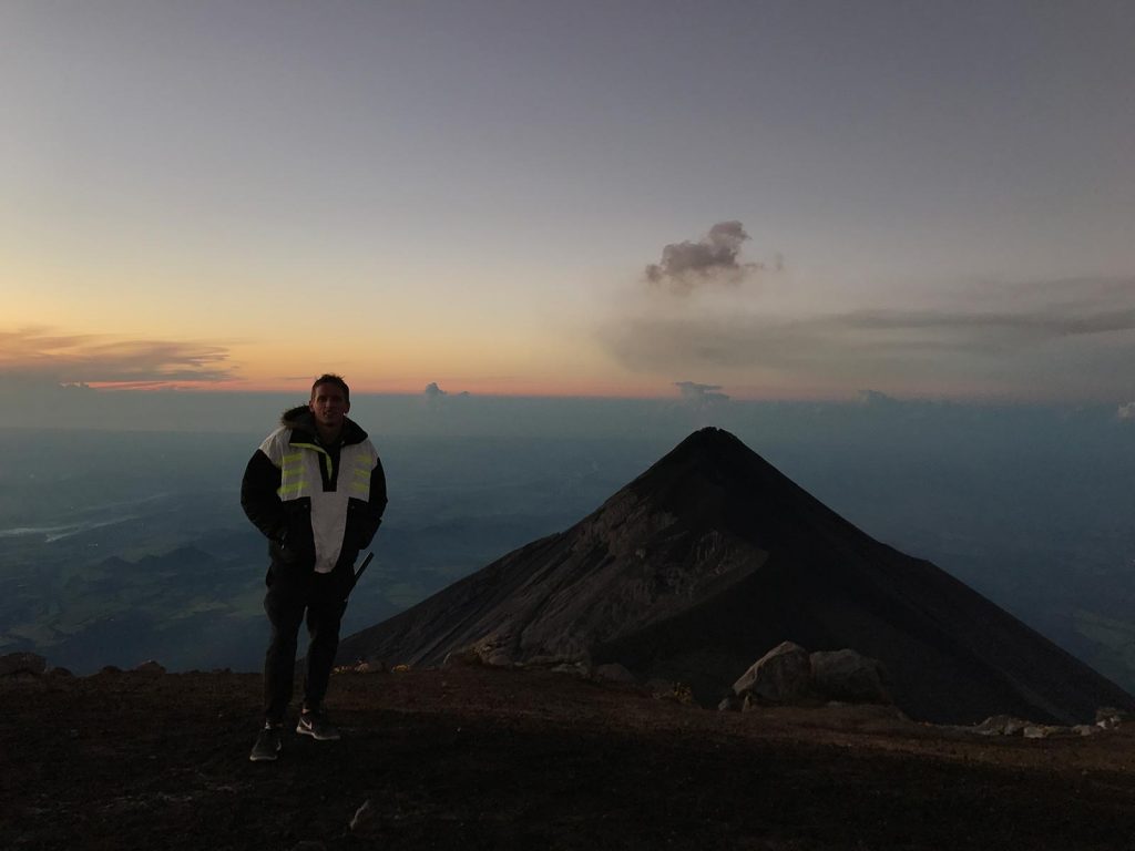 David Simpson and an active volcano in Antigua, Guatemala. Volcano hiking in Guatemala