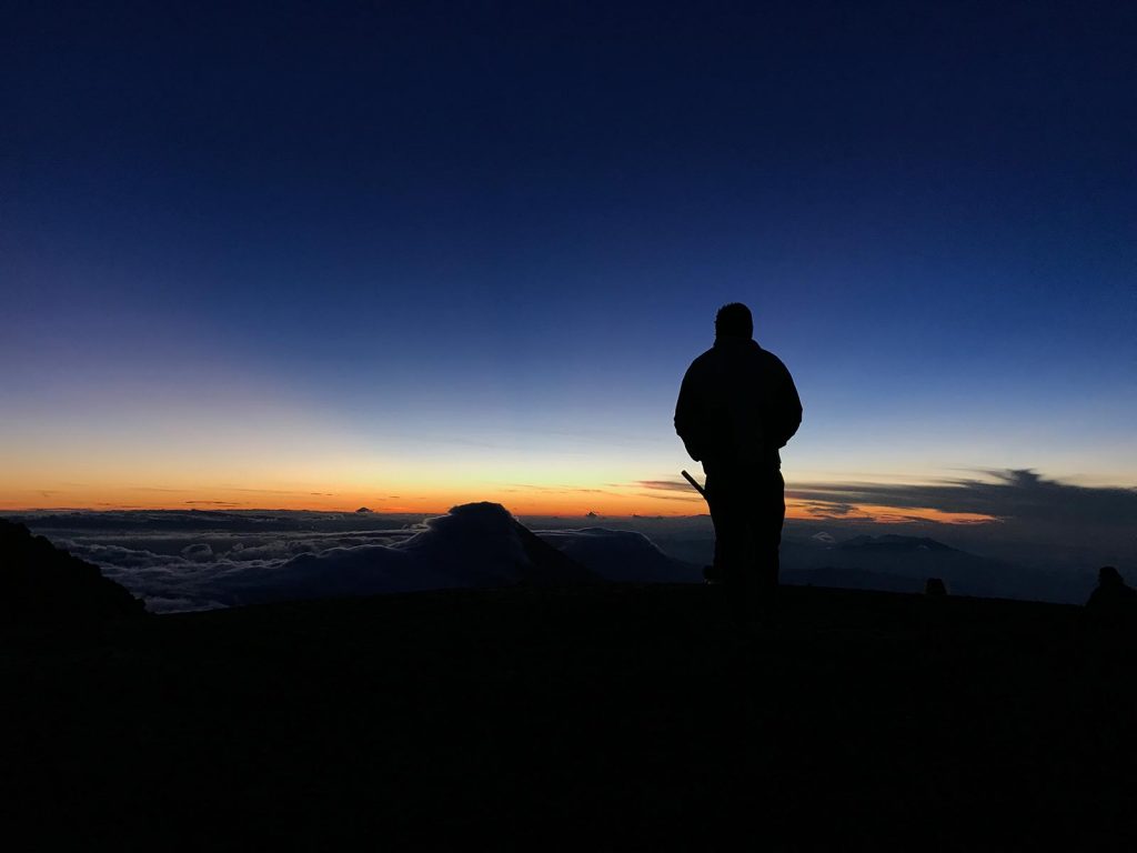David Simpson viewing sunrise in Antigua, Guatemala. Volcano hiking in Guatemala