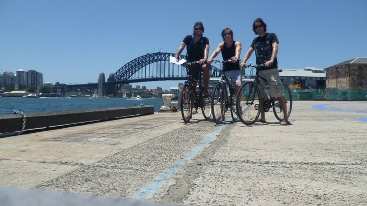David Simpson and two guys biking along the Sydney Harbor Bridge. Walking Sydney Bridge & The Blue Mountains