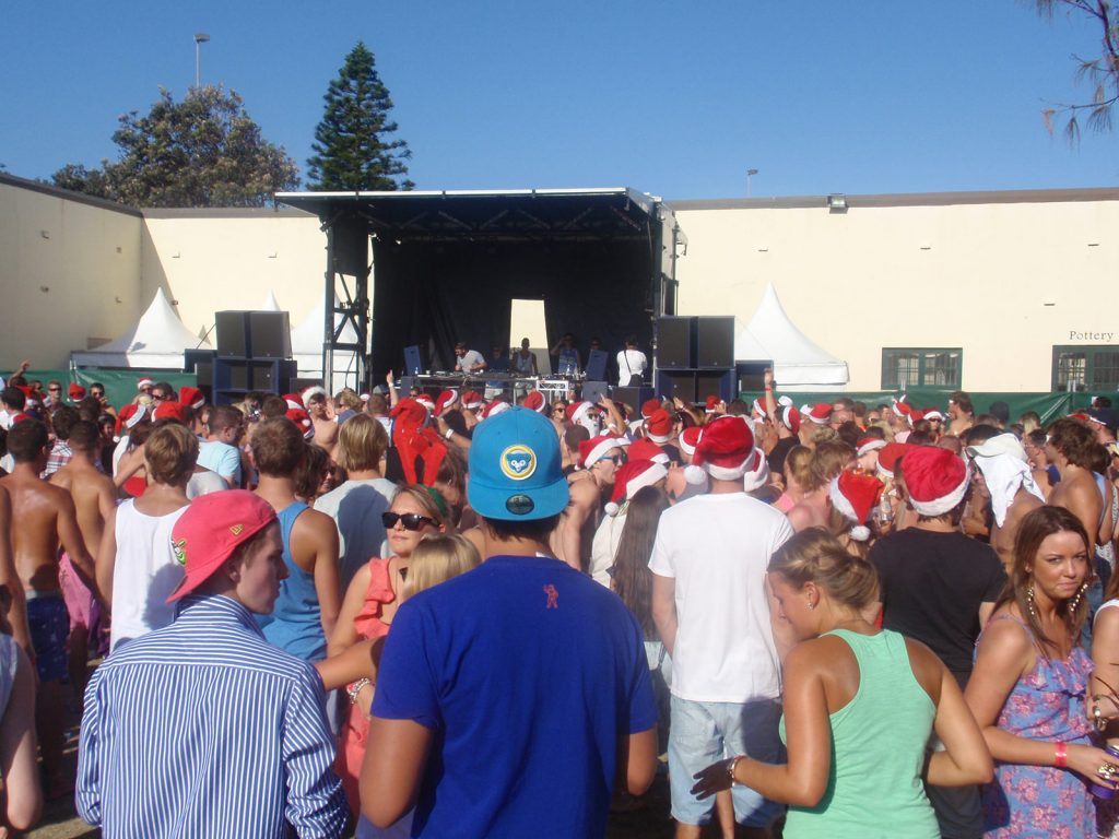 People spending Xmas on Bondi at Sunburnt festival. Xmas & NYE in Bondi, Sydney