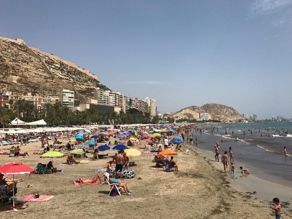 Beach full of people in Alicante, Spain. Moldova - Romania - Alicante