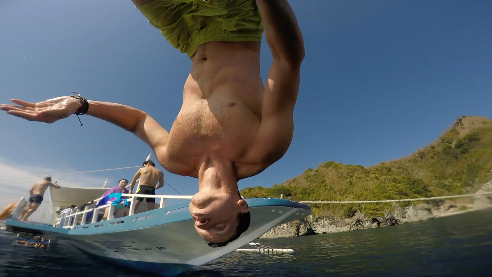 David Simpson about to plunge in the water head first in Apo Island, Philippines. Turtles at Apo Island & Dumaguete