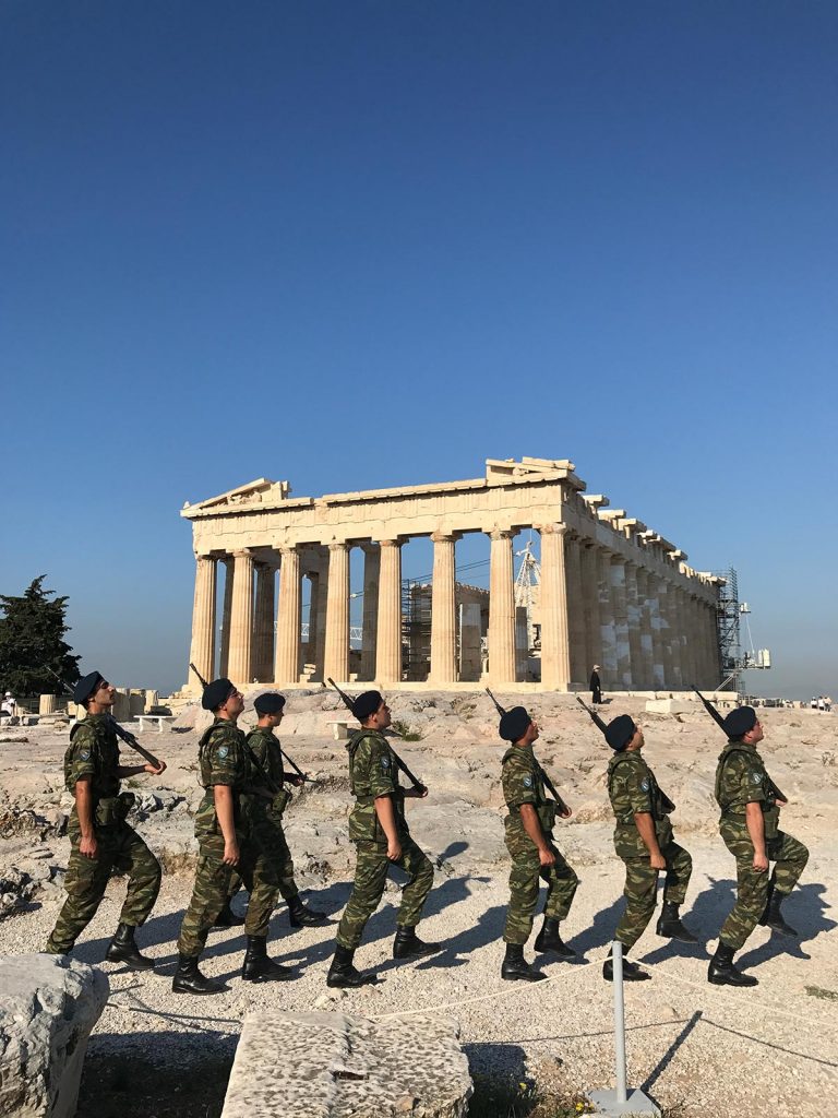 Soldiers marching past the Parthenon in Athens, Greece. Athens has me