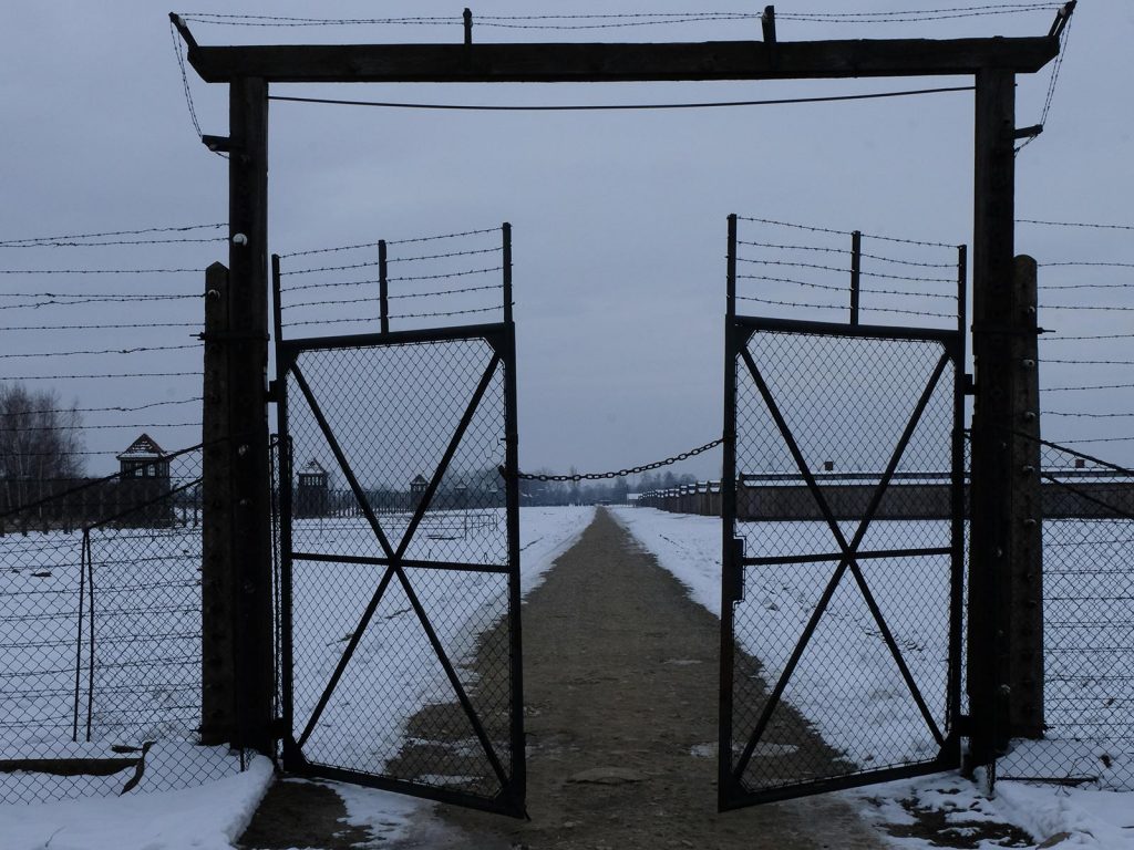 Open gate in Auschwitz, Oświęcim, Poland. Mixed feelings in Auschwitz