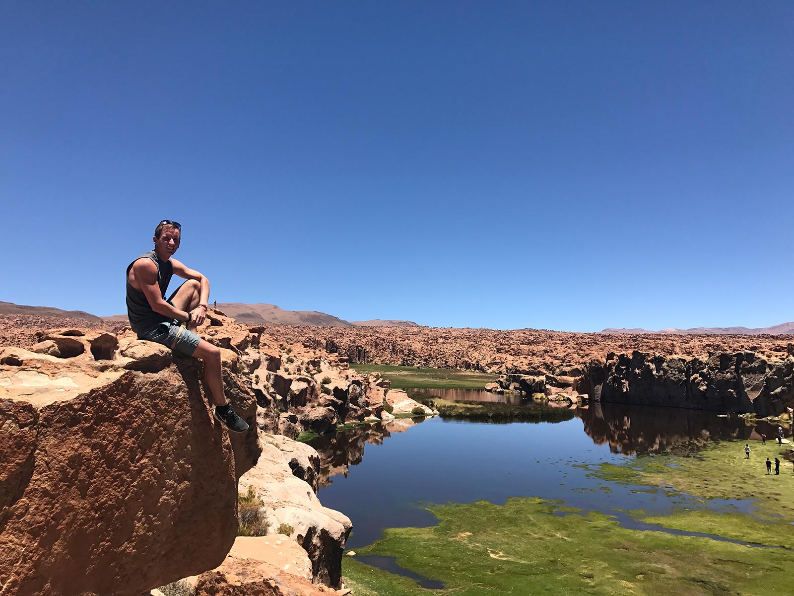 David Simpson by the desert spring pool in Atacama, Chile. Atacama desert & Bolivian salt flats road trip & full guide