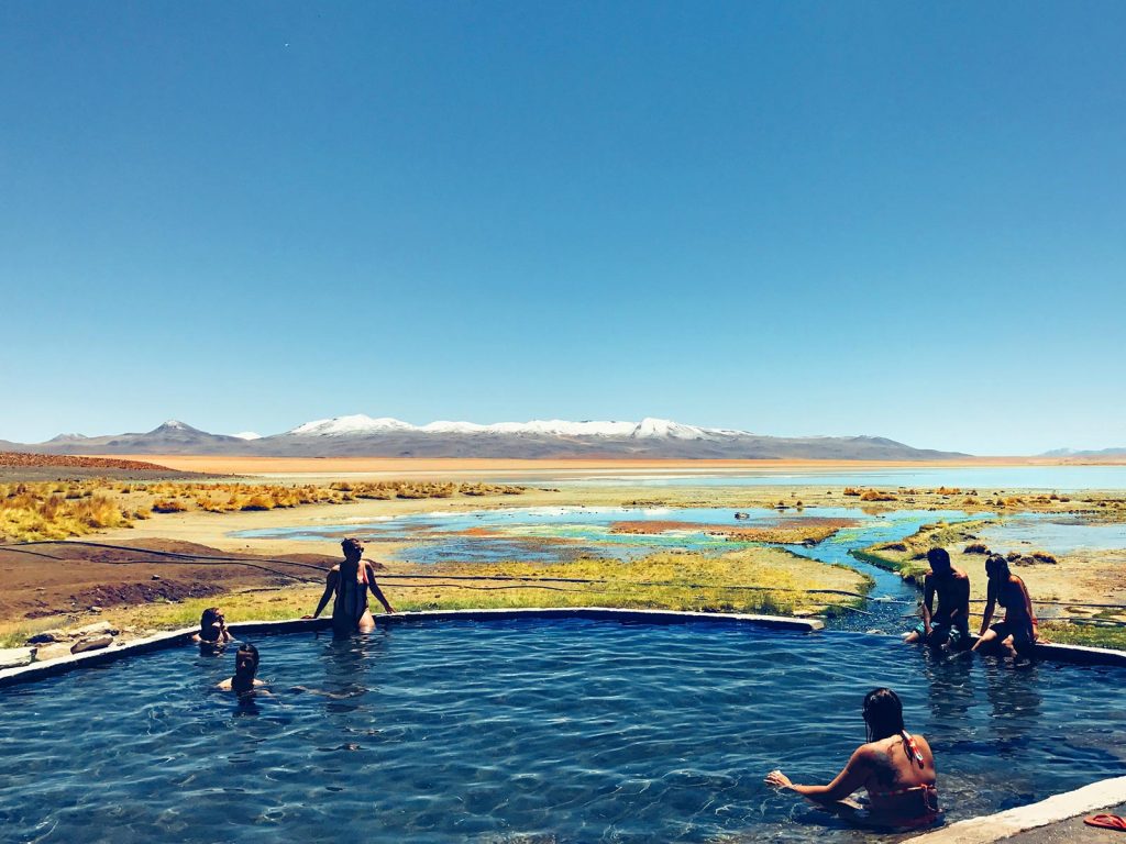 Swimmers at spring pool in Atacama, Chile. Atacama desert & Bolivian salt flats road trip & full guide