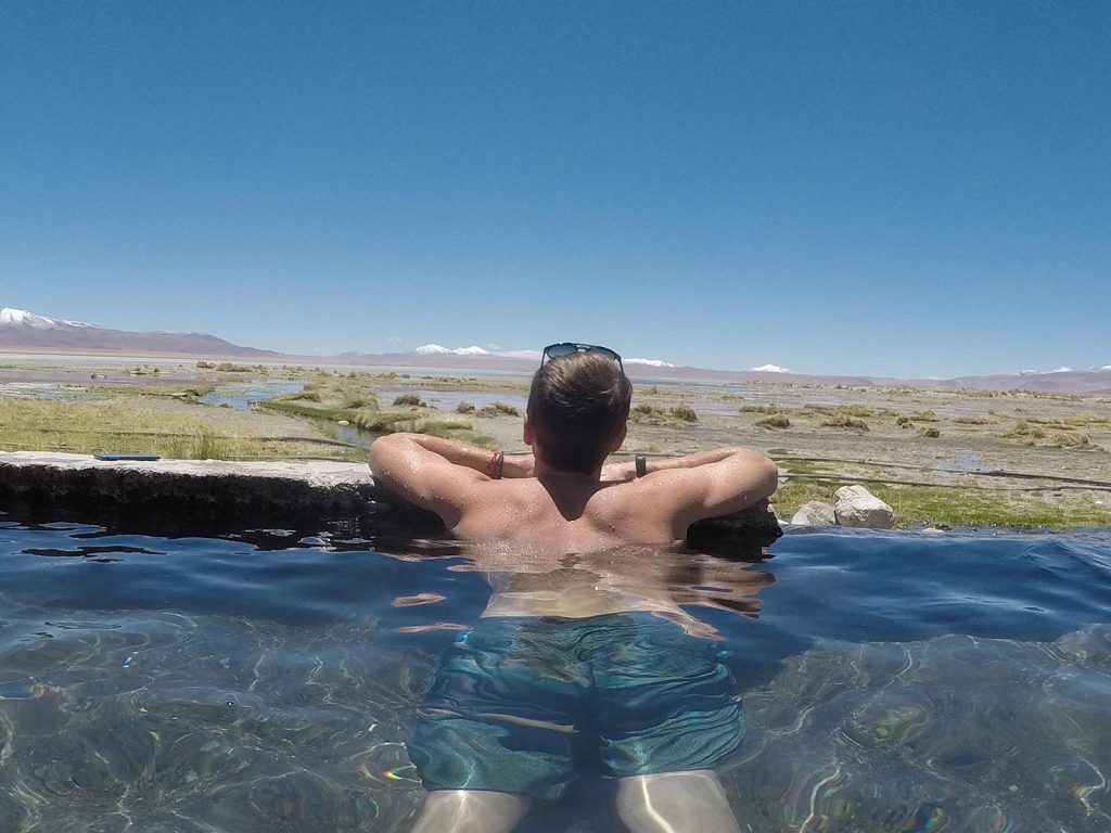 David Simpson swimming at a spring pool in Atacama, Chile. Atacama desert & Bolivian salt flats road trip & full guide
