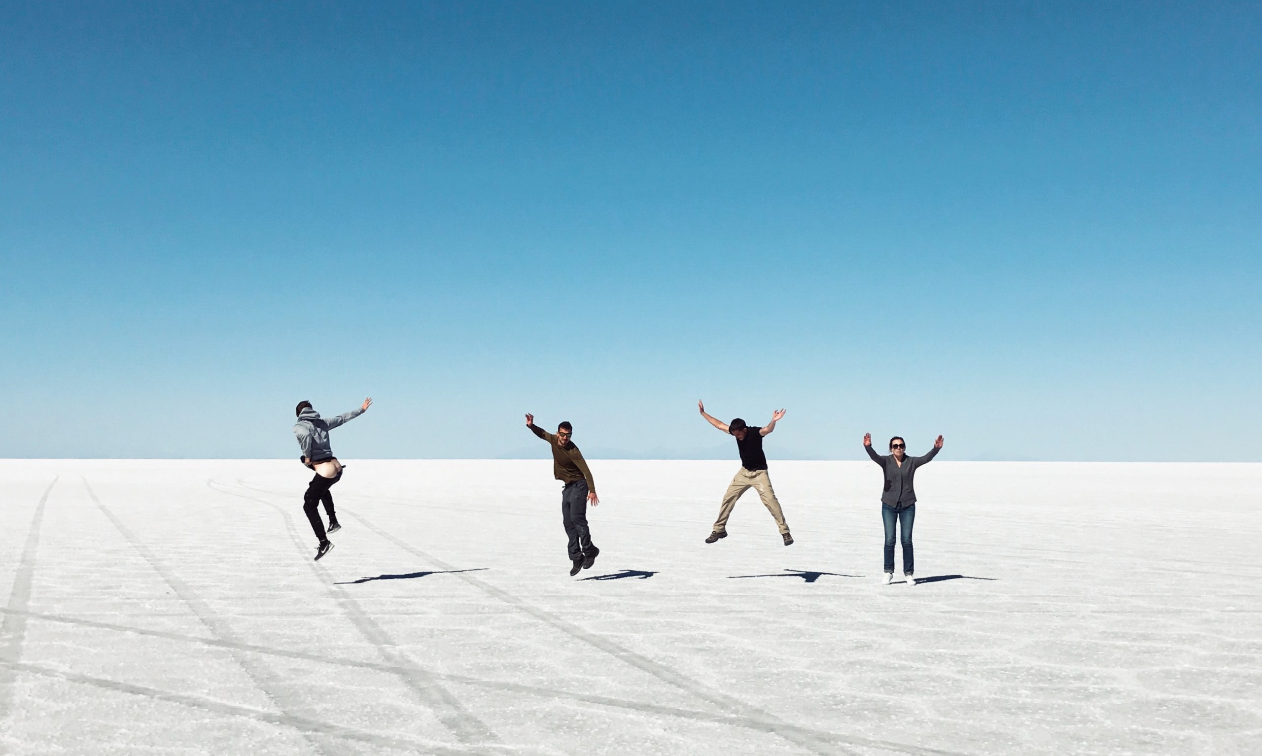 Friends trying to be silly in Uyuni Salt Flat, Bolivia. Atacama desert & Bolivian salt flats road trip & full guide