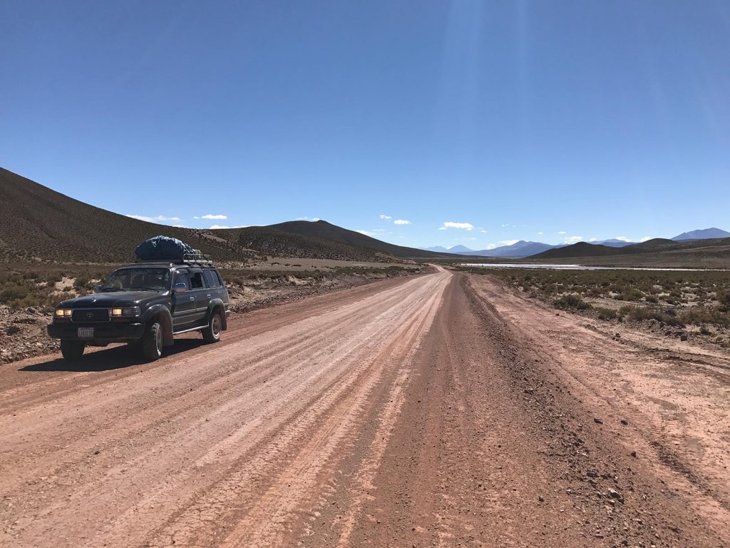Tour vehicle at the desert in Atacama, Chile. Atacama desert & Bolivian salt flats road trip & full guide