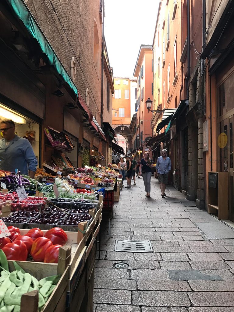 Fruit stand at narrow street in Bologna, Italy. Magical Venice