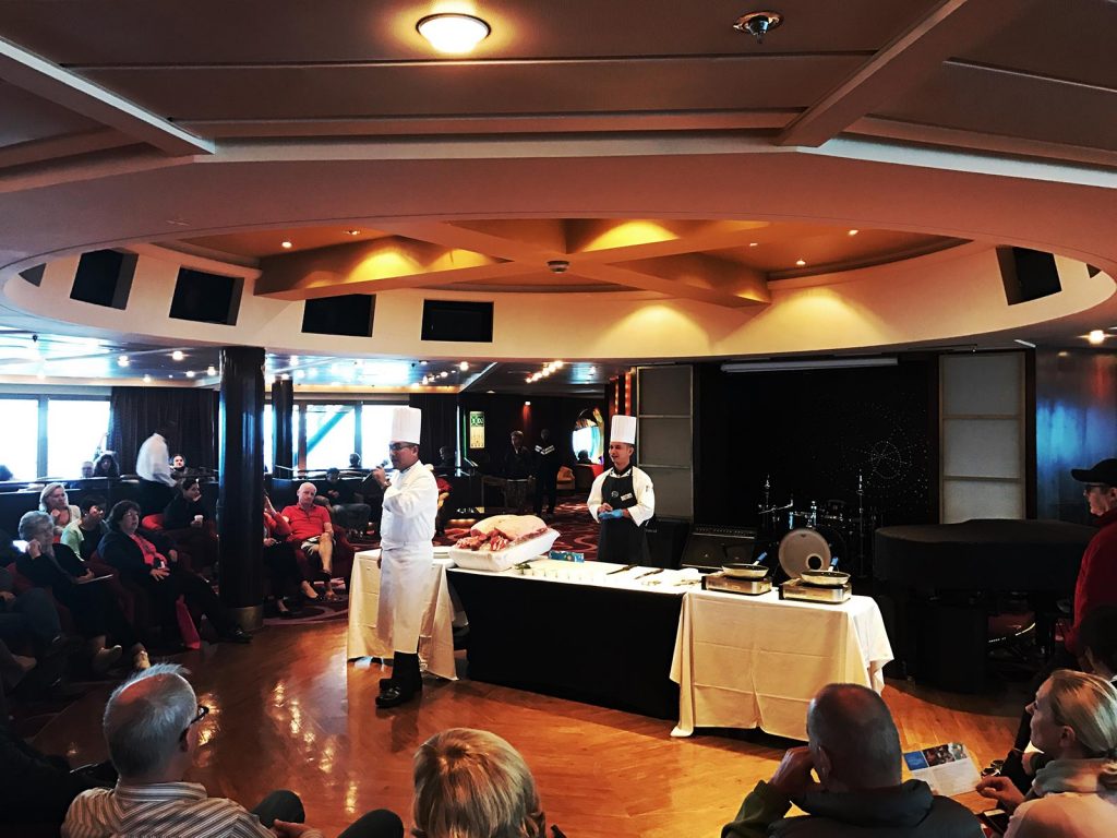 Chef talking to passengers onboard cruise ship at sea. Cape Horn on the Cruise to the end of the world