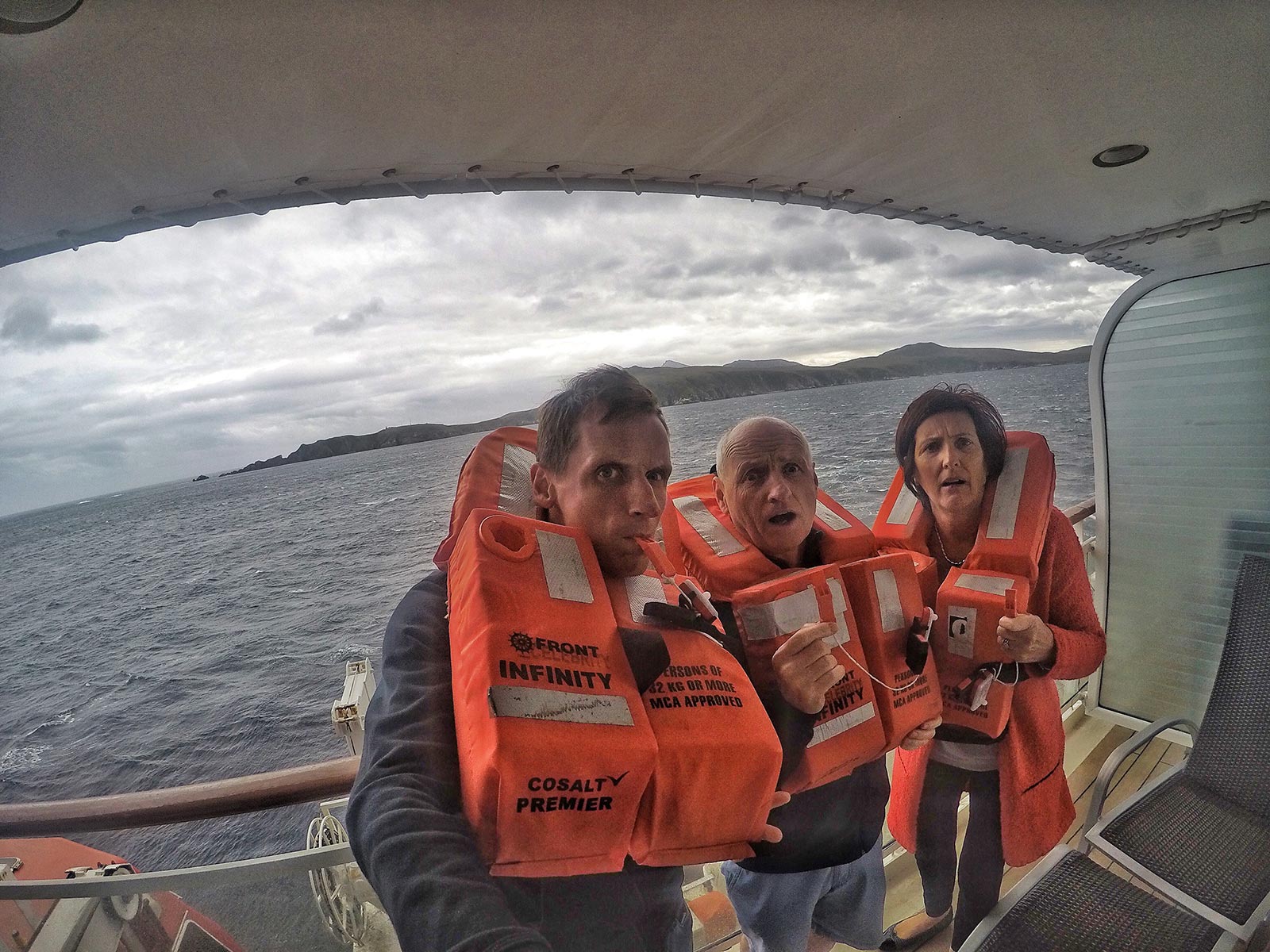 David Simpson and family wearing life vests onboard cruise ship at sea. Cape Horn on the Cruise to the end of the world