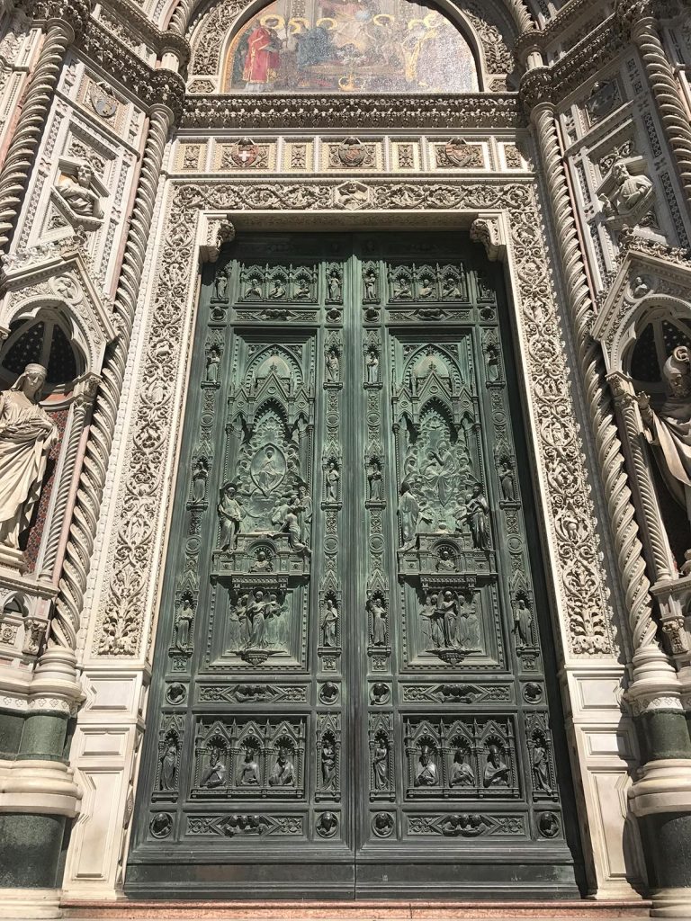 The entrance to Cathedral of Santa Maria del Fiore in Florence, Italy. Leaning Pisa & impressive Florence