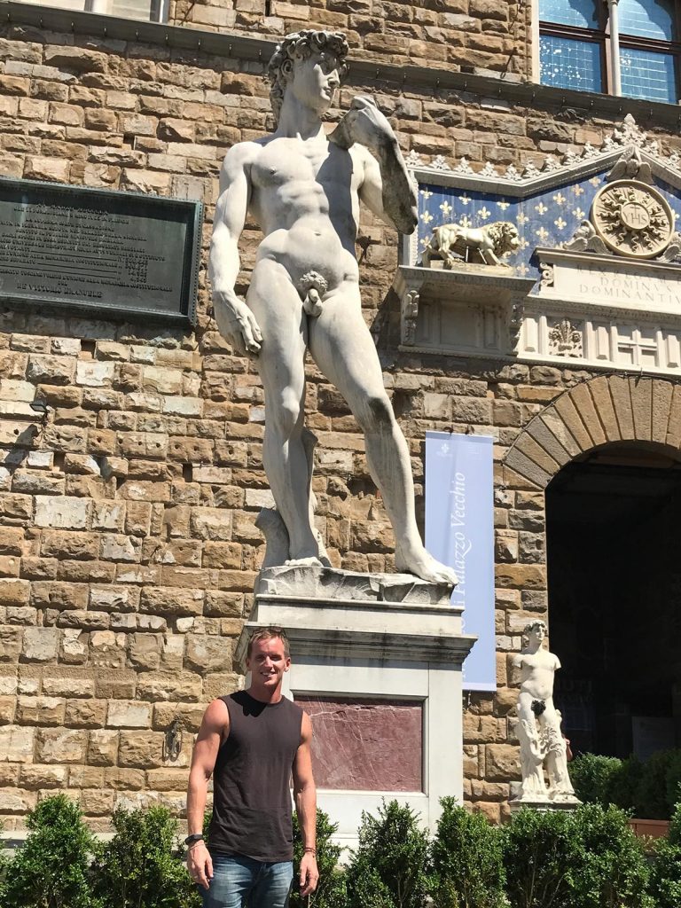 David Simpson and the statue of Michelangelo’s David in Florence, Italy. Leaning Pisa & impressive Florence