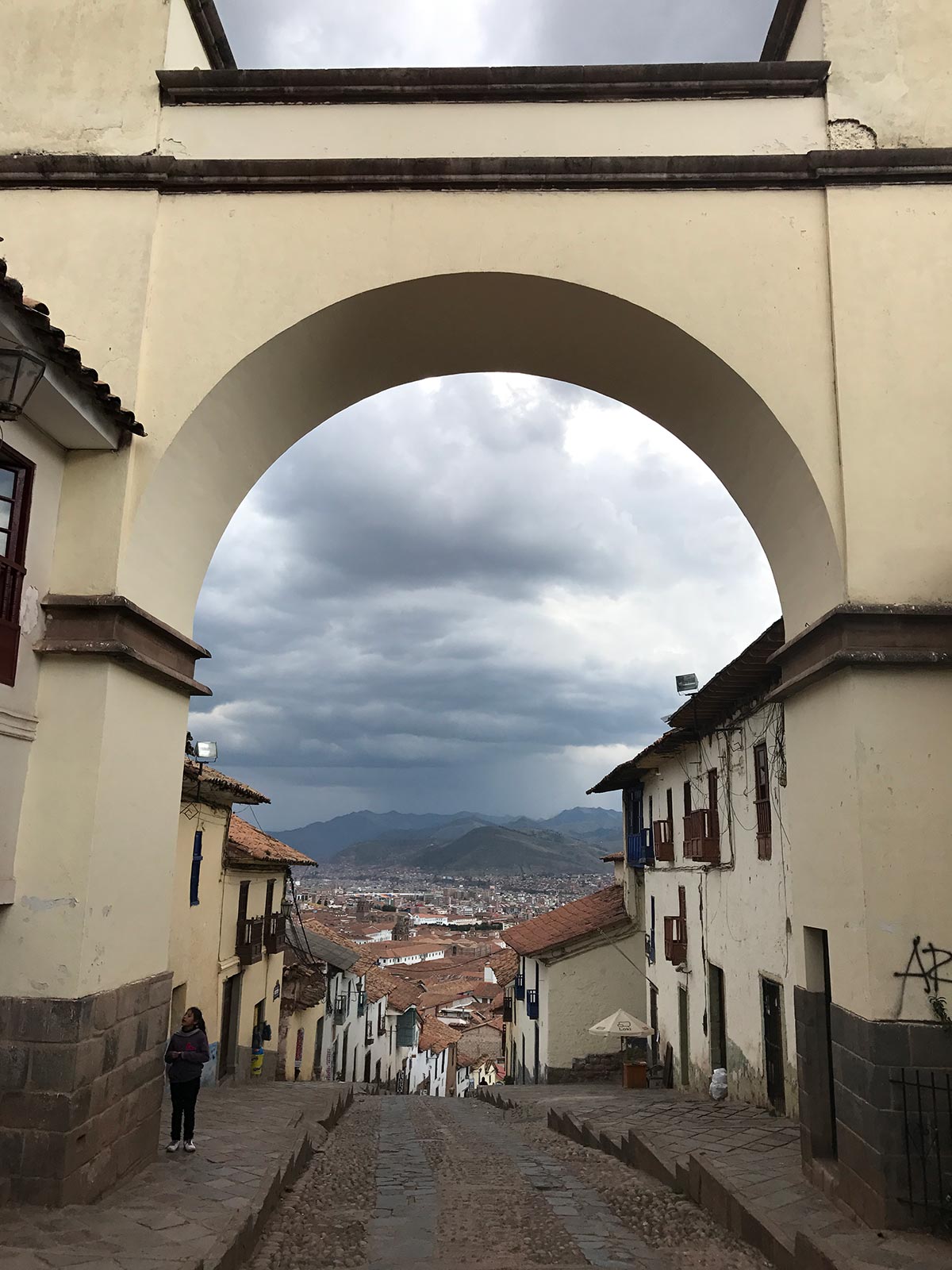 Arch on a street in Cusco, Peru. Getting robbed by Police in Peru
