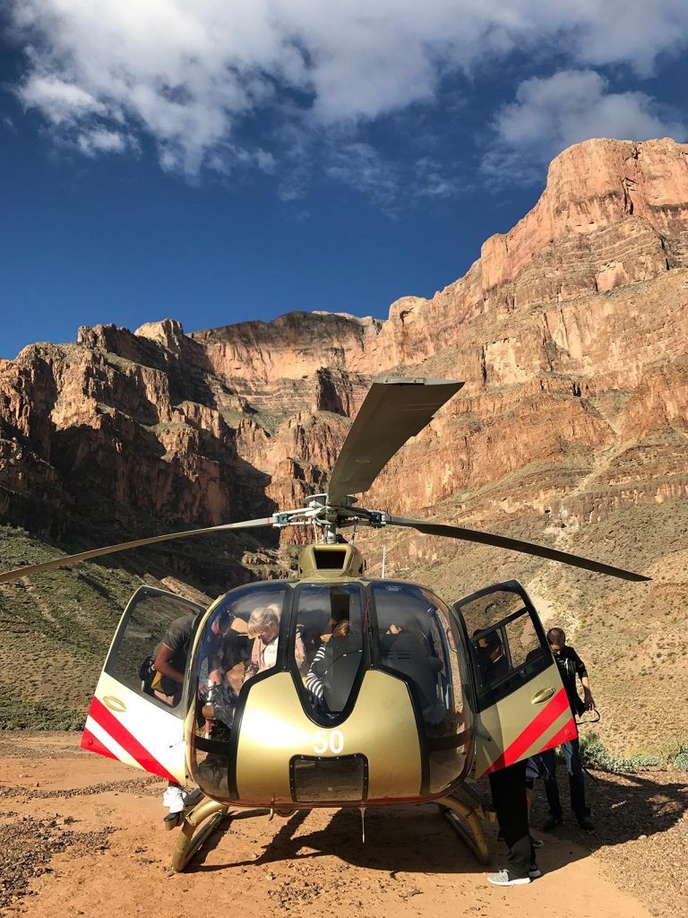Helicopter with people in Grand Canyon, USA. Helicopter tour over the Grand Canyon