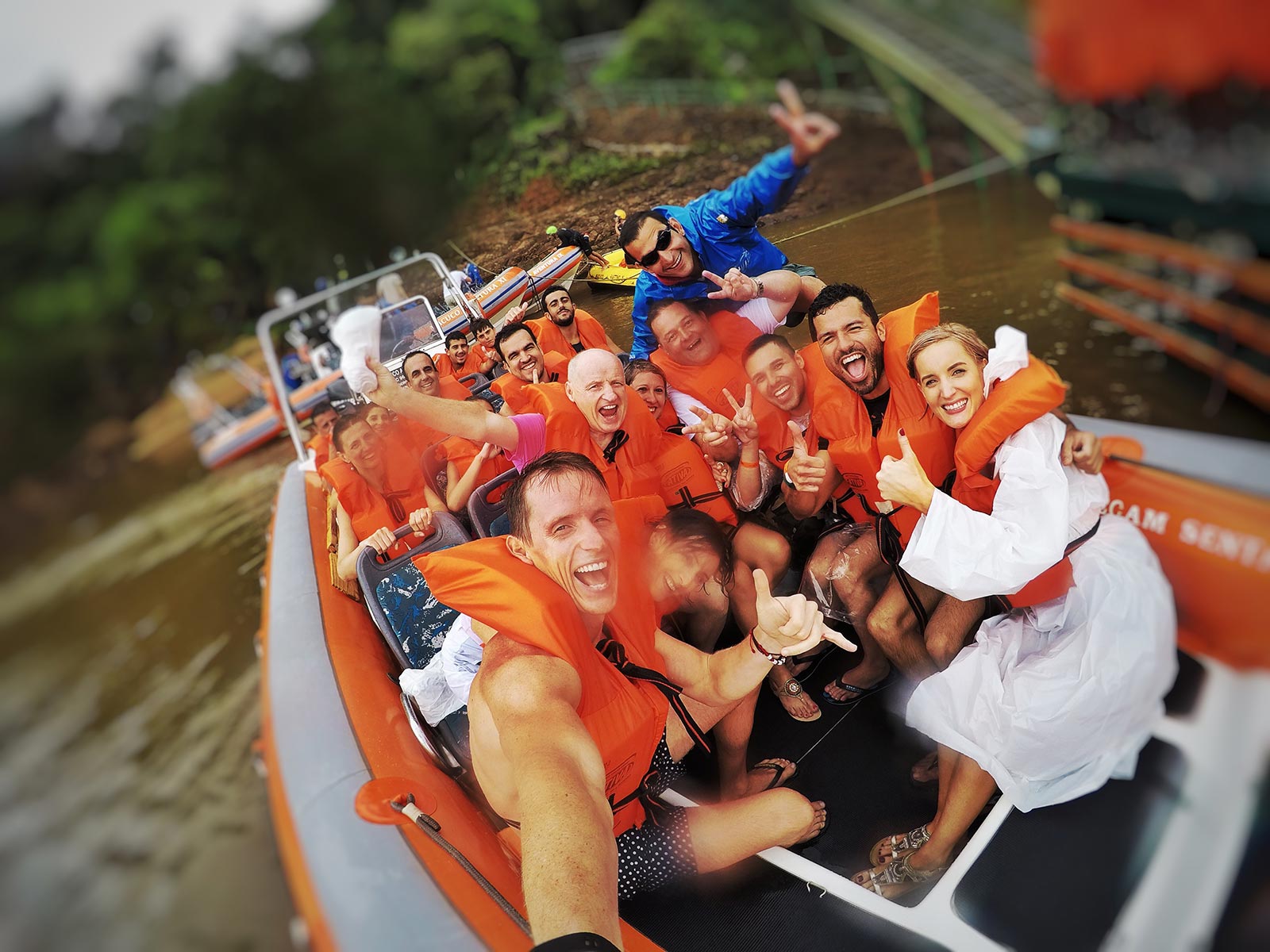 David Simpson with family and friends wearing life vests on a speedboat at Iguazu Falls. Iguazu Falls & the cruise to the end of the World pt1