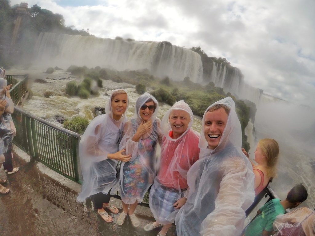 David Simpson and family wearing raincoats at Iguazu Falls. Iguazu Falls & the cruise to the end of the World pt1