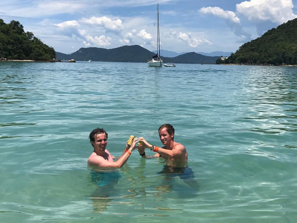 David Simpson and friend at the beach in Ilha Grande, Brazil. Ilha Grande cures the hangover from hell