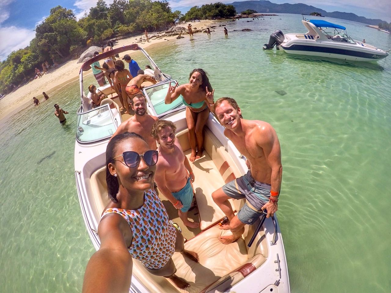 David Simpson and friends near the beach at speedboat tour in Ilha Grande, Brazil. Ilha Grande cures the hangover from hell