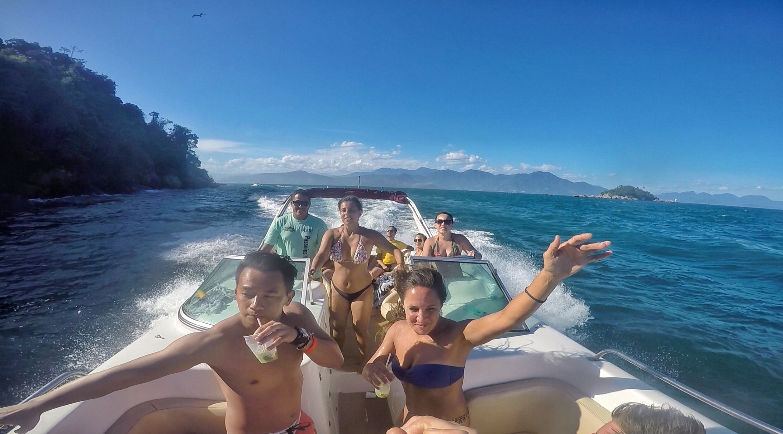 Friends at speedboat tour in Ilha Grande, Brazil. Ilha Grande cures the hangover from hell