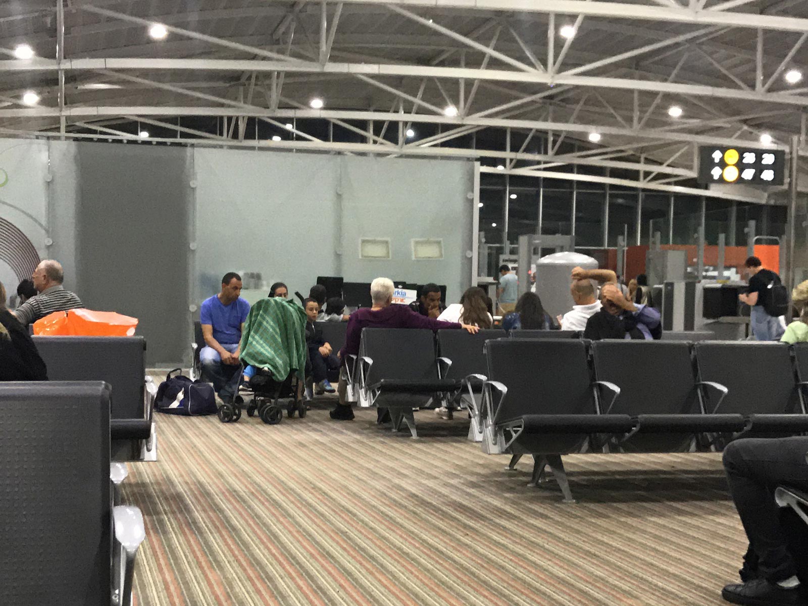 People seated at airport in Tel Aviv, Israel. Interrogated & strip searched in Israel